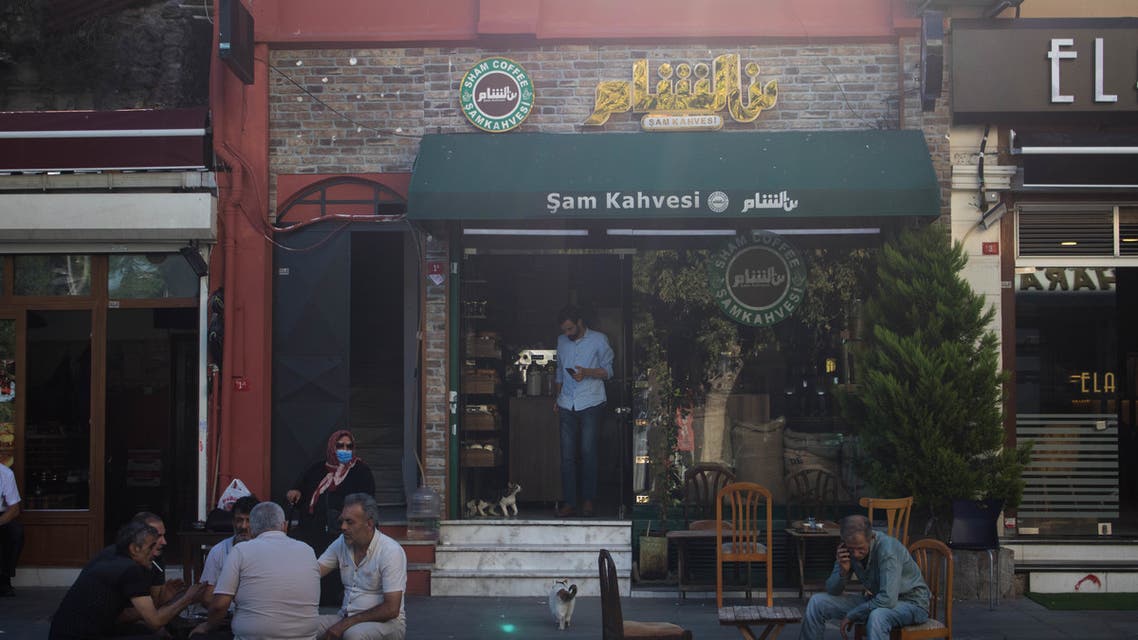 People sit outside a cafe in the Turkish capital Istanbul's Little Damascus neighborhood. (Nicholas Frakes)