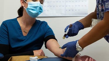 A file photo shows a blood sample is articulated after being taken from an employee of Oro Valley Hospital, for an antibody test for the coronavirus disease at the University of Arizona in Tucson, Arizona, US, July 10, 2020. (Reuters)