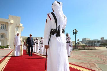 Turkey's President Recep Tayyip Erdogan, right, walks with the Emir of Qatar Sheikh Tamim bin Hamad Al Thani, left, as they review an honour guard during the welcome ceremony in Doha, Qatar. (File photo: AP)
