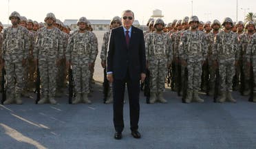 Turkey's President Recep Tayyip Erdogan, center, poses for photographs with Turkish Armed Forces's soldiers, during his visit at the Qatari-Turkish Armed Forces Land Command Base in Doha, Qatar. (File photo: AP)