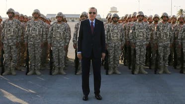 Turkey's President Recep Tayyip Erdogan, centre, poses for photographs with Turkish Armed Forces's soldiers, during his visit at the Qatari-Turkish Armed Forces Land Command Base in Doha, Qatar. (File photo: AP)