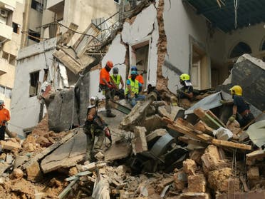 A rescue team searches the rubble in Beirut's Mar Mikhael area. (Twitter)