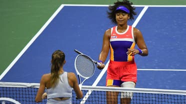 Naomi Osaka of Japan greets Camila Giorgi of Italy at the net following their match on day three of the 2020 US Open at Flushing Meadows, New York, USA, on September 2, 2020. (Reuters)