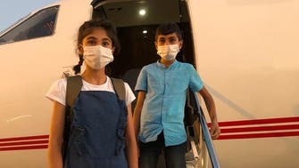 بالصور.. طفلان عراقيان يعودان بعد سنوات في كنف داعش