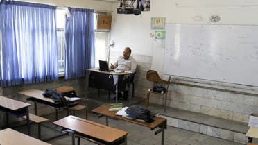 A teacher is seen while teaching online school classes in Iran. (Reuters)