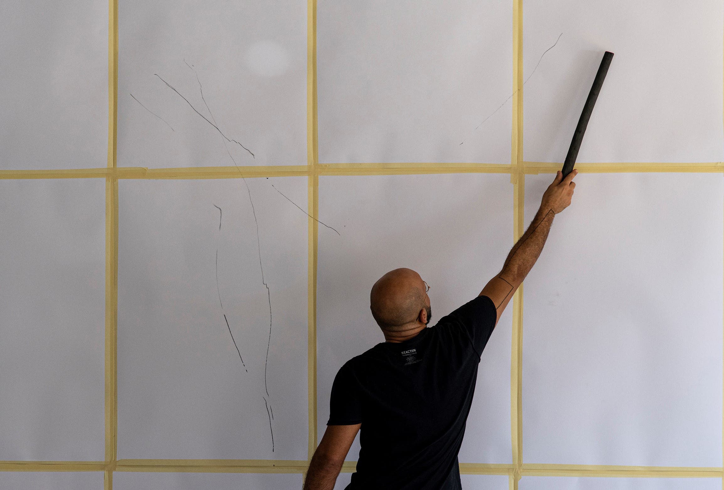 Abed Al Kadiri is shown during the process of creating the first mural, which took about two weeks to complete. (Photo courtesy of Laetita Hakim.)