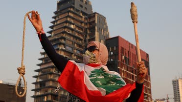 A woman holds a noose as she observes a minute of silence to mark one month since the massive explosion at the city's port area, in Beirut, Lebanon September 4, 2020. (Reuters)