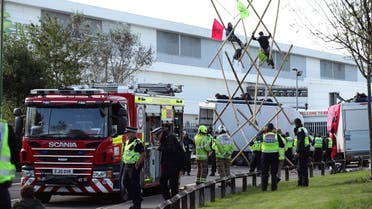 Police and fire services at the scene, outside Broxbourne newsprinters as protesters continue to block the road, in Broxbourne, Hertfordshire, England, Sept. 5, 2020. (AP)
