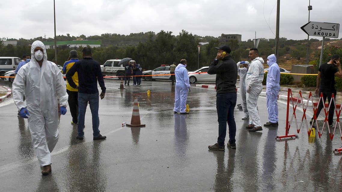 Tunisian forensic police investigate the site of an attack on Tunisian National Guard officers on September 6, 2020, in Sousse, south of the capital Tunis. (AFP)