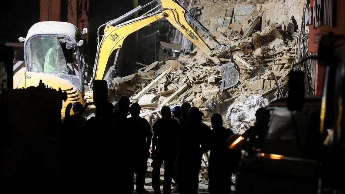 Machinery works at the site of buildings which collapsed by the explosion at the city's port area, in Gemmayze, Beirut. (Reuters)