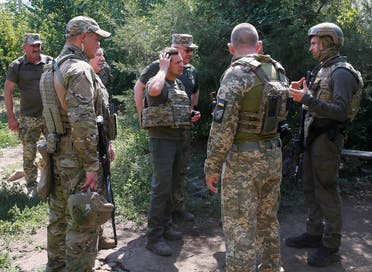 Ukraine's President Volodymyr Zelenskiy speaks to servicemen near the frontline with Russian-backed separatists in Krasnohorivka in Donetsk Region, Ukraine August 7, 2020. (Reuters)