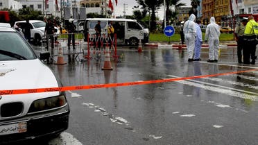 Tunisian forensic police investigate the site of an attack on Tunisian National Guard officers on September 6, 2020, in Sousse, south of the capital Tunis. (AFP)