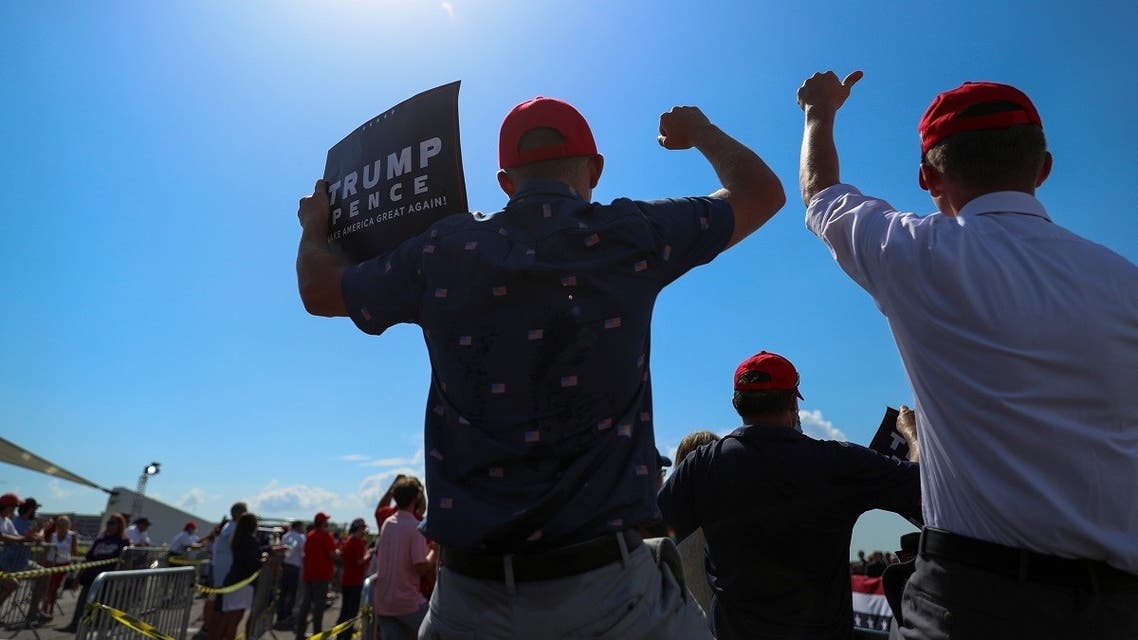 Men cheer as they stand in a closely packed crowd of Trump supporters, most without masks, listening to U.S. President Donald Trump speak to the crowd after arriving at Tampa International Airport. (File photo: Reuters)