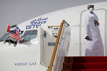 An official stands at the door of an Israeli El Al airliner after it landed in Abu Dhabi, United Arab Emirates on August 31, 2020. (AP)