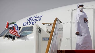 An official stands at the door of an Israeli El Al airliner after it landed in Abu Dhabi, United Arab Emirates on August 31, 2020. (AP)