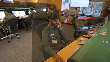 Police officers monitor the streets and receive calls from citizens at the Command and Control Center of Dubai Police in the Gulf emirate, on February 24, 2020. (AFP)