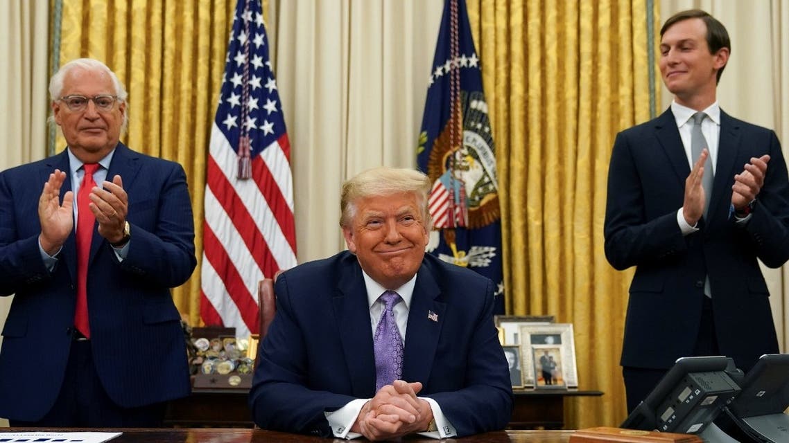 US Ambassador to Israel David Melech Friedman and White House senior adviser Jared Kushner applaud after US President Donald Trump announced a peace deal between Israel and the UAE from the Oval Office of the White House in Washington, US, August 13, 2020. (Reuters)