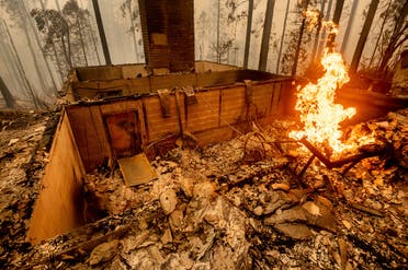 Flames burn at a home leveled by the Creek Fire along Highway 168 on, Sept. 8, 2020, in Fresno County, Calif. (AP)
