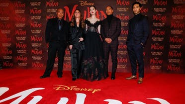 Cast members Ron Yuan, Yifei Liu, Jason Scott Lee and Yoson An pose with director Niki Caro, at the European premiere for the film Mulan in London, Britain March 12, 2020. (Reuters)