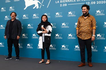 Director Majid Majidi (from left), actors Shamila Shirzad and Javad Ezati pose at the photo call for the film ‘Khorshid’ (‘Sun Children’) at the Venice Film Festival on September 6, 2020. (AP)