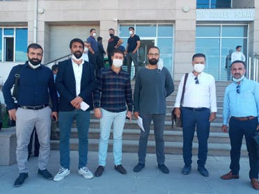 Turkish journalist Oktay Candemir, second from left, outside a courthouse in Turkey. (Supplied)