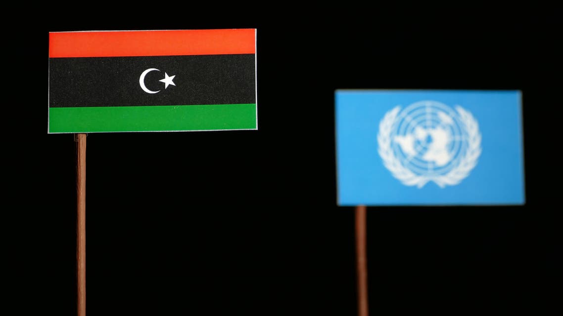 Belgrade, Serbia. May 5th 2017: Libyan flag with United Nations flag isolated on black background stock photo