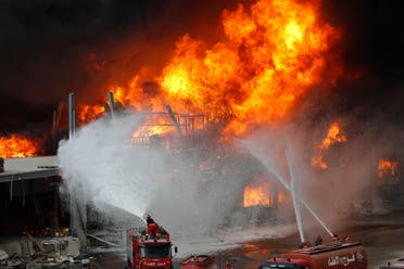 Firefighters work to extinguish a fire at warehouses at the seaport in Beirut on Sept. 10. 2020. (AP)