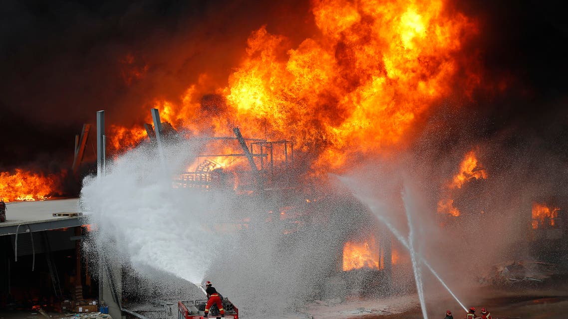 Firefighters work to extinguish a fire at warehouses at the seaport in Beirut on Sept. 10. 2020. (AP)
