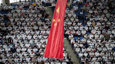 The Chinese national flag hangs from the ceiling as students sit at the Huazhong University of Science and Technology in Wuhan, Sept. 4, 2020. (AFP)