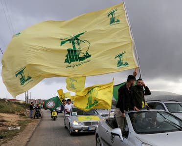 A supporter of Lebanon's Hezbollah gestures as he holds a Hezbollah flag in Marjayoun, Lebanon, May 7, 2018. (File photo: Reuters) 