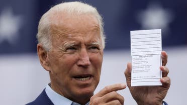 Democratic presidential nominee Joe Biden shows a copy of his schedule and notes during a campaign event in Michigan, Sept. 9, 2020. (Reuters)