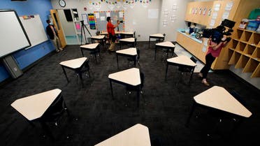 Media members document the inside of a fifth grade classroom set up for social distancing at A.J. Whittenberg Elementary School of Engineering on July 20, 2020, in Greenville, S.C. (AP)