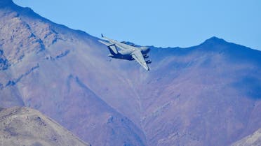 An Indian Air Force's (IAF) C-17 Globemaster transport plane flies over a mountain range in Leh. (Reuters)