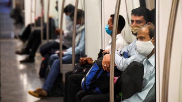 Commuters sit in a carriage of a Yellow Line train after Delhi Metro Rail Corporation (DMRC) resumed services following its closure due to the Covid-19 Coronavirus pandemic in New Delhi on September 7, 2020. India overtook Brazil on September 7 as the country with the second highest number of confirmed coronavirus cases, but authorities pressed ahead with opening up the South Asian nation's battered economy.
