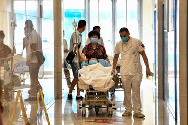 Patients and medical workers wearing face masks are seen at Tongji Hospital in Wuhan, China's central Hubei province on September 3, 2020, during a media visit to the facility organised by local authorities. 