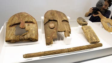 Wooden objects from Berlin's Ethnological Museum are on display during a restitution ceremony in Berlin on May 16, 2018. (AFP)