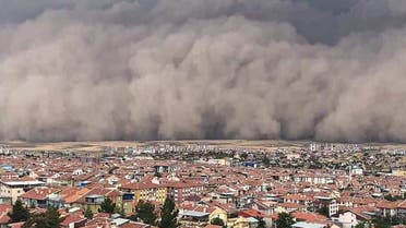 A handout TV grab made available by the Demiroren News Agency (DHA) on September 12, 2020, shows a freak sandstorm sweeping over Polatli, in Ankara. (AFP)
