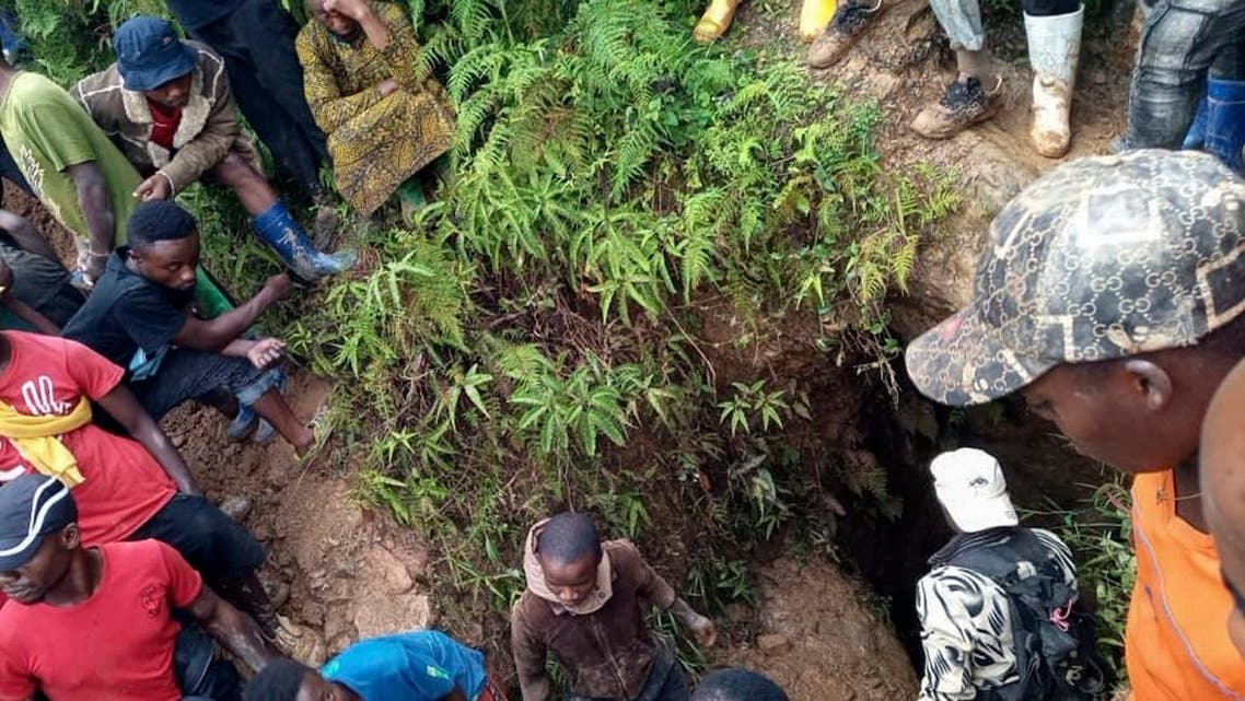 People gather at the scene of a gold mine collapse near the town of Kamituga, South Kivu province, in eastern Congo, on September 11, 2020. (AP)