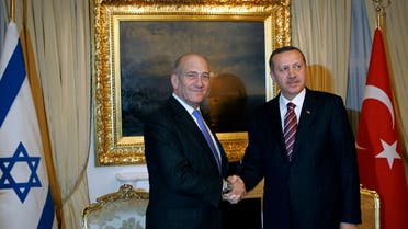Israeli Prime Minister Ehud Olmert, left, and his counterpart Recep Tayyip Erdogan shake hands Ankara, Dec. 22, 2008. (AP)