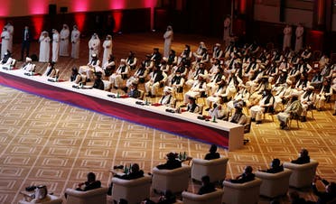 Delegates attend talks between the Afghan government and Taliban insurgents in Doha, Qatar, on September 12, 2020. (Reuters)