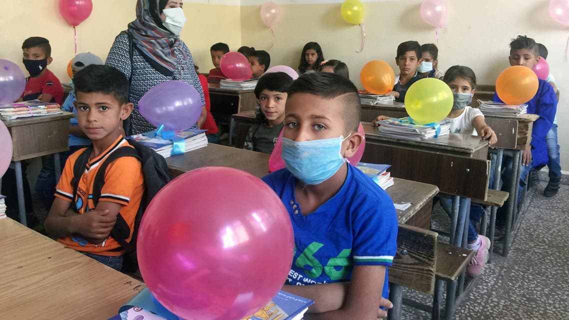 In this photo released by the Syrian official news agency SANA, students attend a lesson on their first day back at school, in Qamishli, Syria, Sunday, Sept. 13, 2020. (AP)
