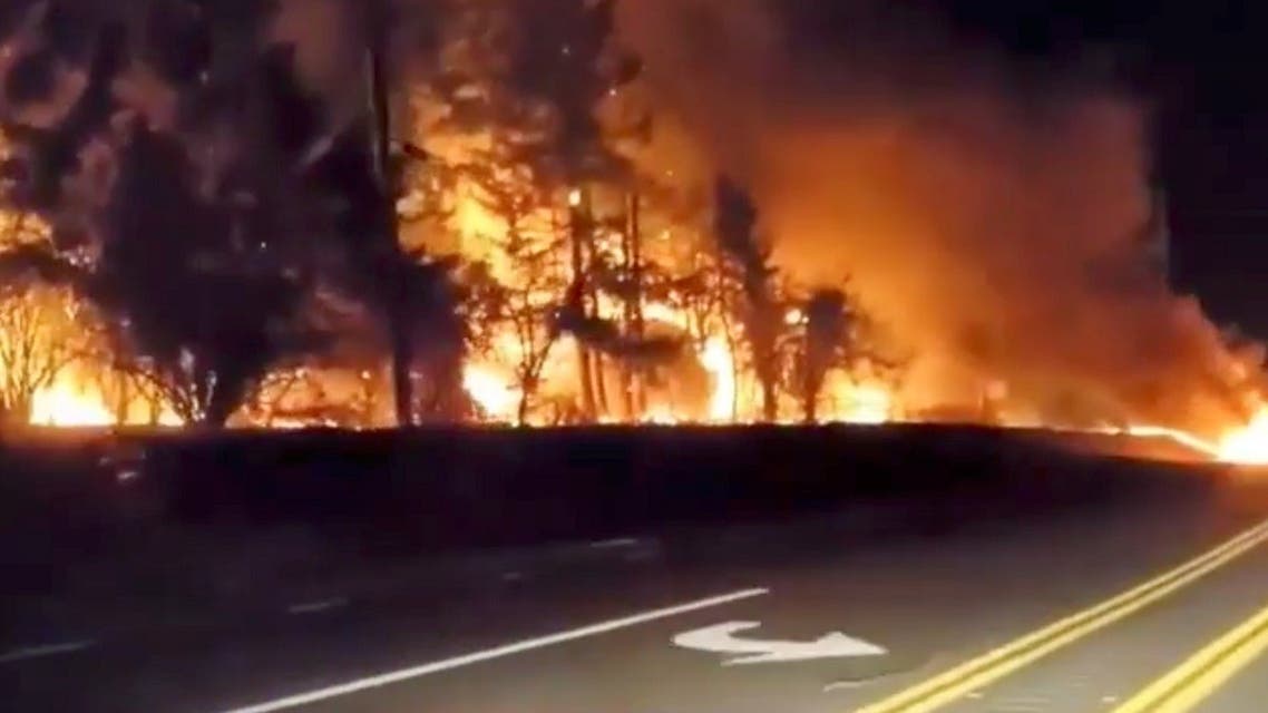Vegetation is seen on fire along a side road in Molalla, Oregon, September 9, 2020, in this still image from a social media video obtained by Reuters. (Social Media)