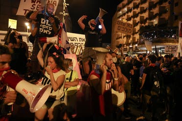 Israeli protesters shout slogans during an anti-government demonstration in front of PM Netanyahu's residence in Jerusalem on September 12 2020. (AFP)