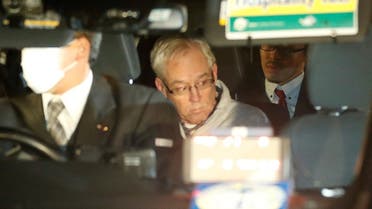 Greg Kelly, the former deputy of ousted Nissan chairman Carlos Ghosn, is seen in the car, as he leaves after being released from a detention centre in Tokyo, Japan, December 25, 2018. (Reuters)