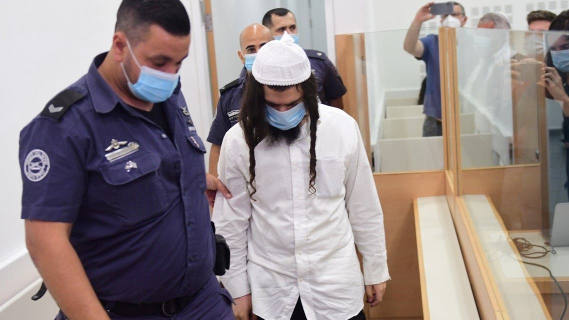 Amiram Ben-Uliel is brought for a verdict in the case of the 2015 arson attack, which killed a Palestinian toddler and his parents in the Israeli-occupied West Bank. (Reuters)