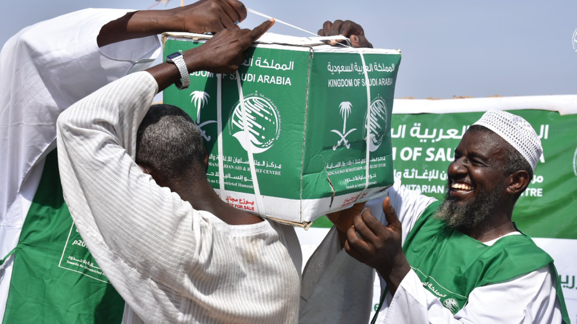 KSrelief volunteers deliver aid packages to people affected by the floods in Sudan. (Twitter)