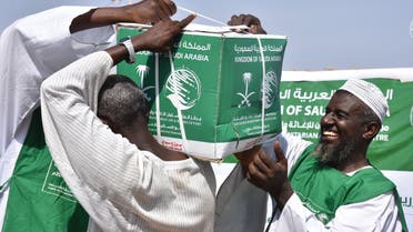KSrelief volunteers deliver aid packages to people affected by the floods in Sudan. (Twitter)