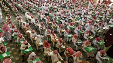 Secondary school students sit for an exam at the Abu Baker Al Arabi government school in Riyadh June 20, 2010. (Retuers)
