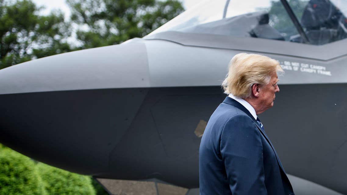 US President Donald Trump stands with an F-35 at the White House, July 23, 2018. (AFP)