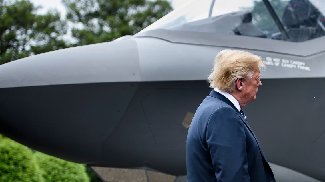 US President Donald Trump stands with an F-35 on the South Lawn of the White House during an event to showcase American made products at the White House July 23, 2018 in Washington, DC. (AFP)